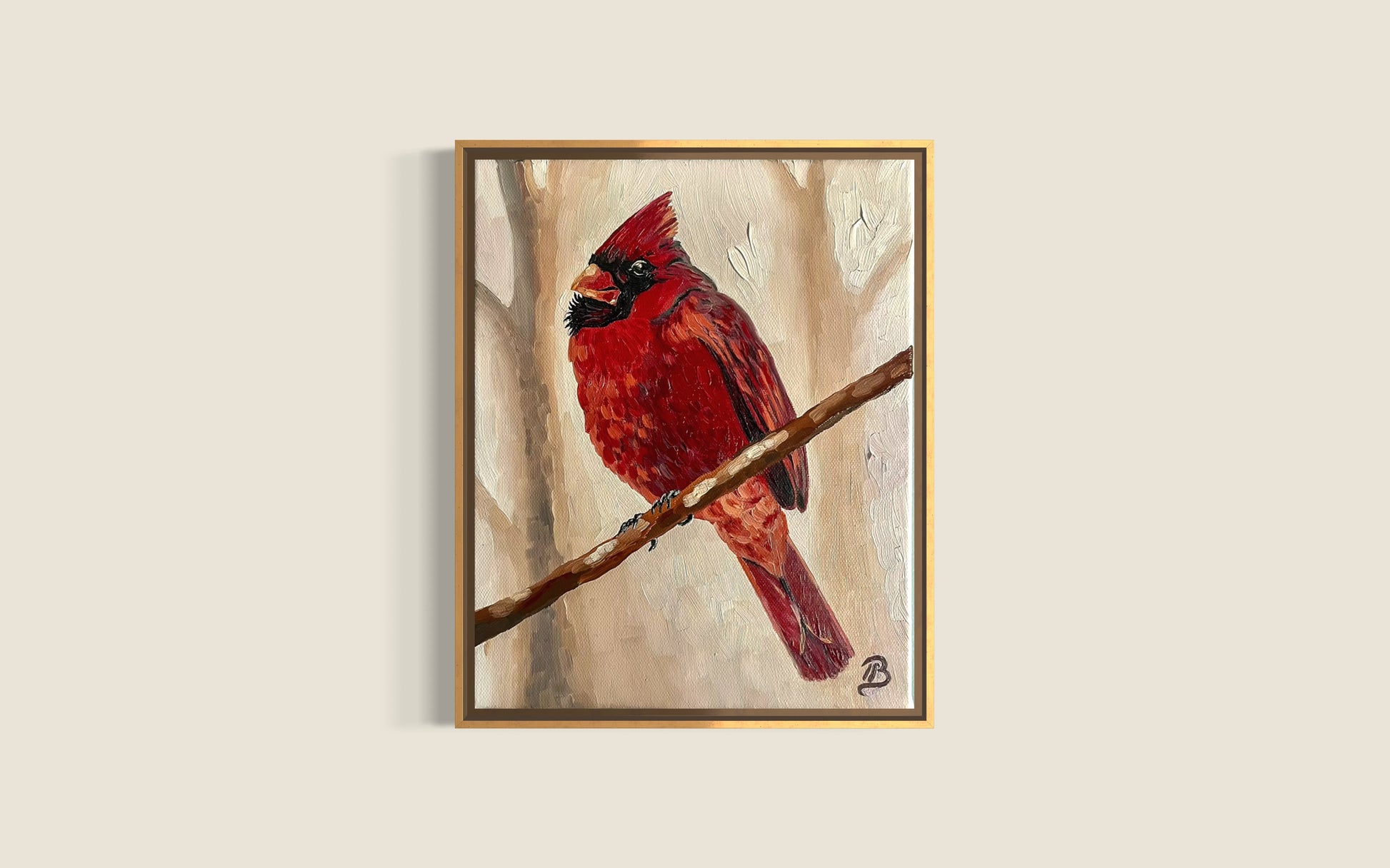 Framed artwork of a red cardinal bird on a branch against a beige background