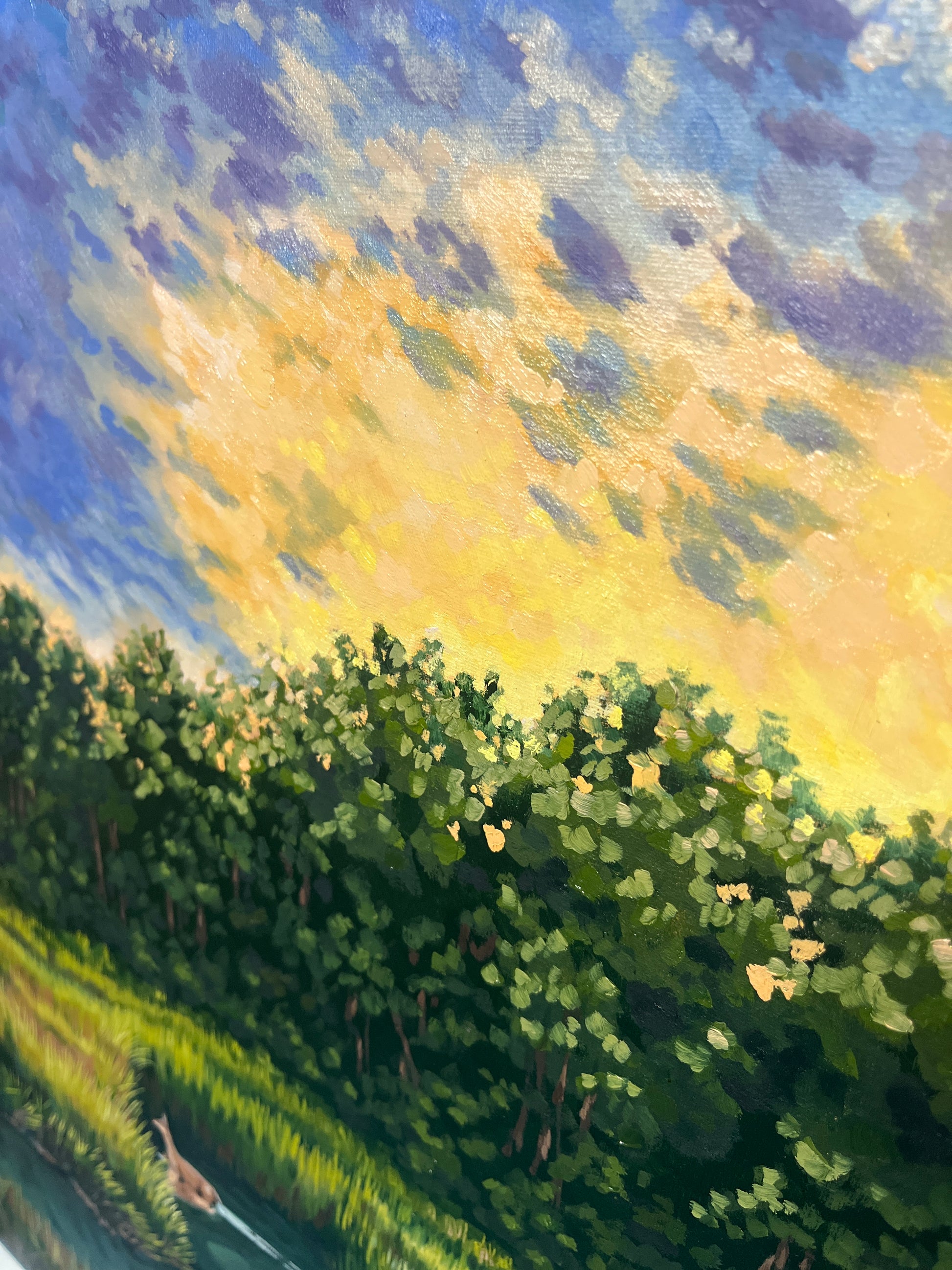 Landscape painting of a marsh at sunset with a deer wading through the water. Close up view of sky and treetops.