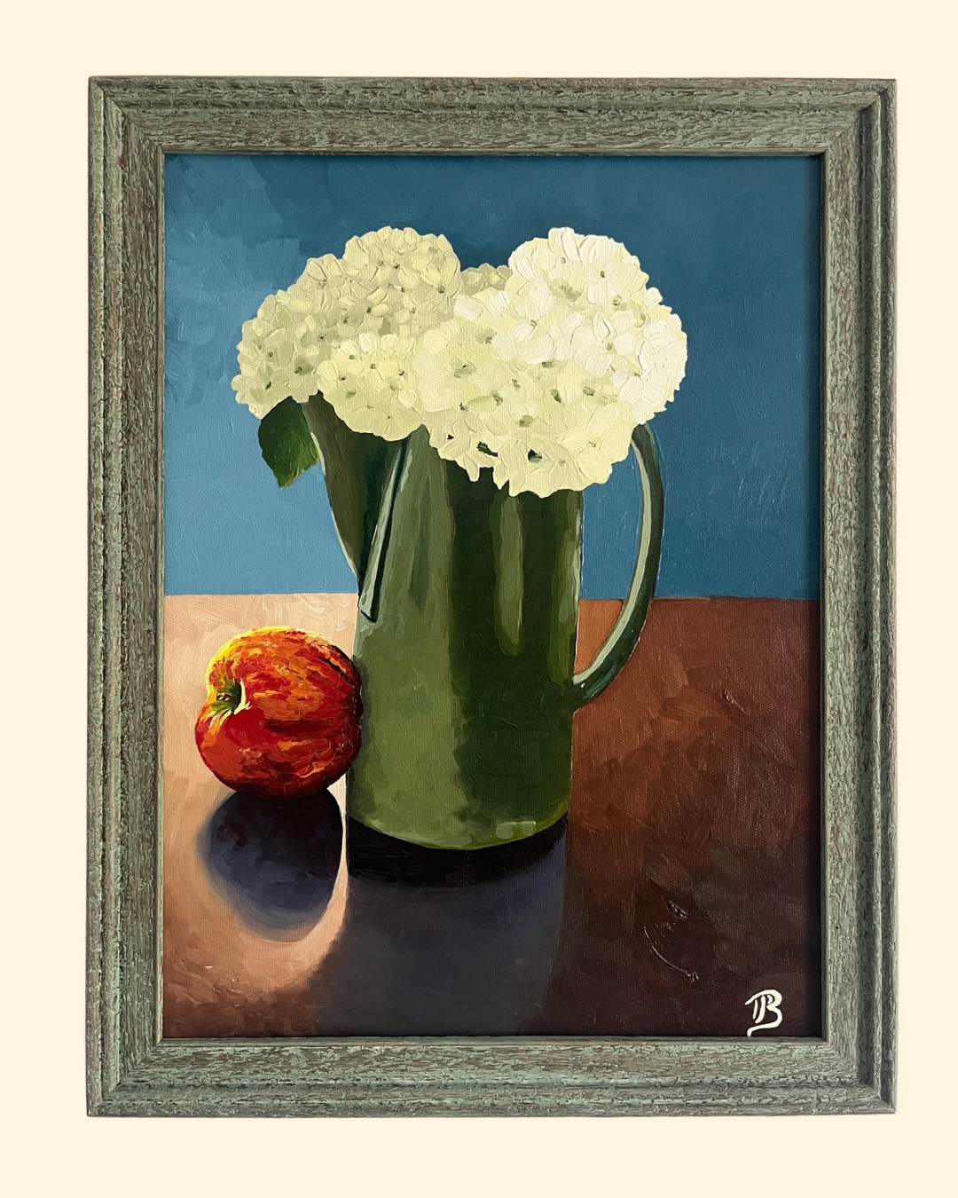 Original still life oil painting of white hydrangeas arranged in a green pitcher with a red honey crisp apple placed beside it. The painting is framed in a greenish teal distressed wood frame.