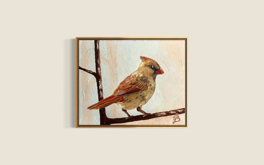 Framed artwork of a female cardinal on a branch against a light background