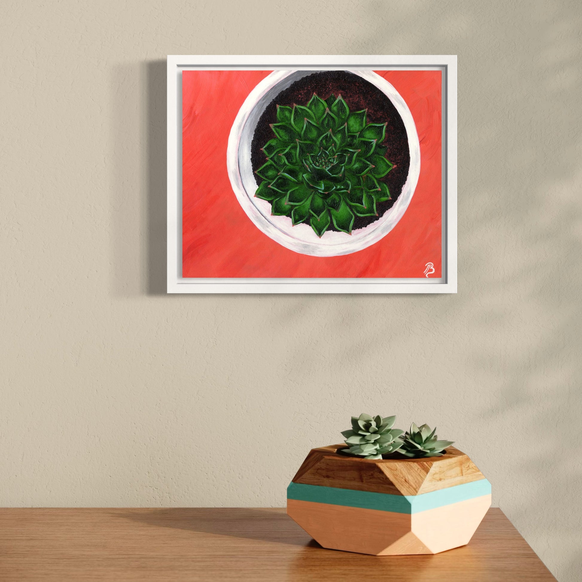 Original acrylic painting of a green succulent in a white pot with a coral pink background in a white float frame