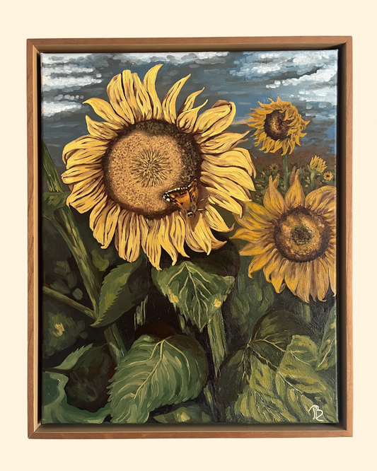 Original oil painting of a sunflower field. The largest yellow sunflower in the foreground has a butterfly resting on the petals. The painting is framed in a warm solid wood floater frame.