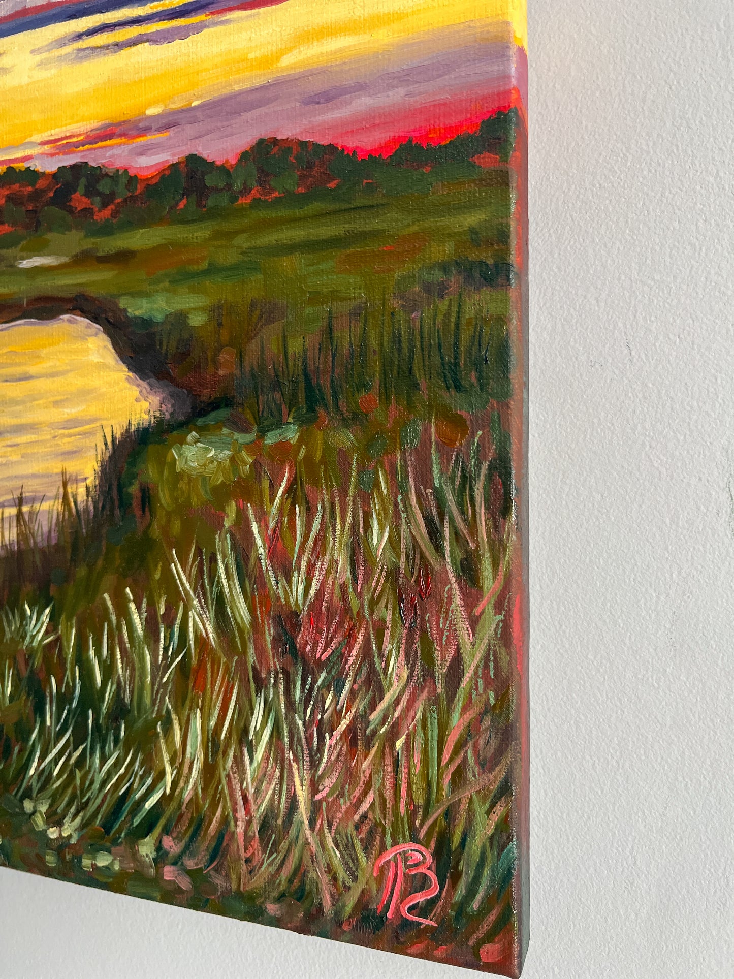 Painting of a sunset over water with marsh grass in the foreground, signed by artist Blair Owens, 'BP'.